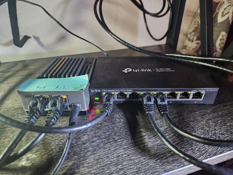 Image of the Zimaboard connected to the switch and the WiFi extender