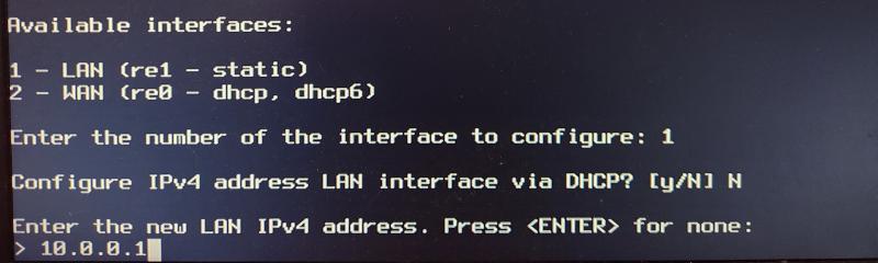OPNsense CLI showing the command to assign 10.0.0.1 to the LAN interface